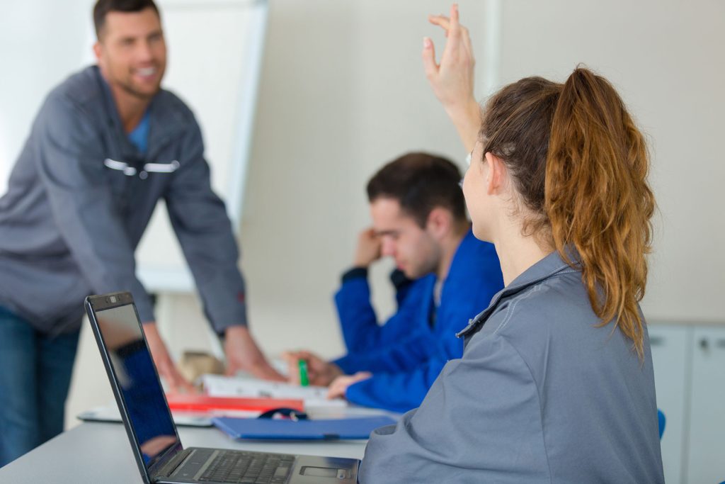 Trainer leading a small group workplace training session
